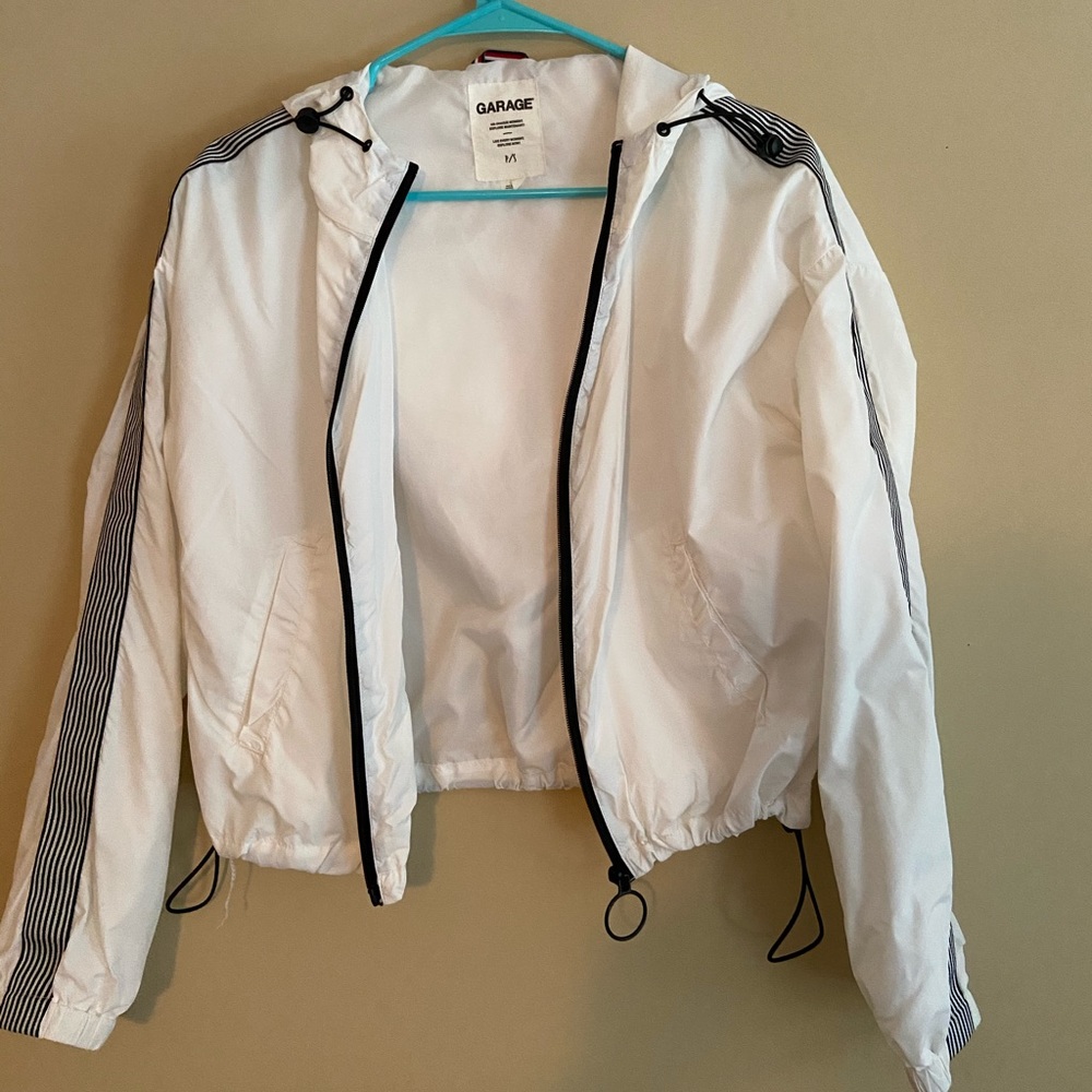 White zip up wind breaker